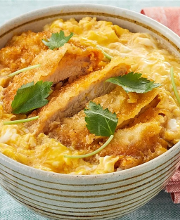 Katsudon (Japanese breaded pork, rice, shredded cabbage salad and tsukemono pickled vegetables)