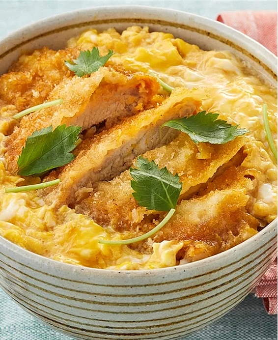 Katsudon (Japanese breaded pork, rice, shredded cabbage salad and tsukemono pickled vegetables)